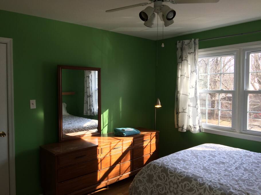 Large dresser. Room is sunny with room-darkening shades