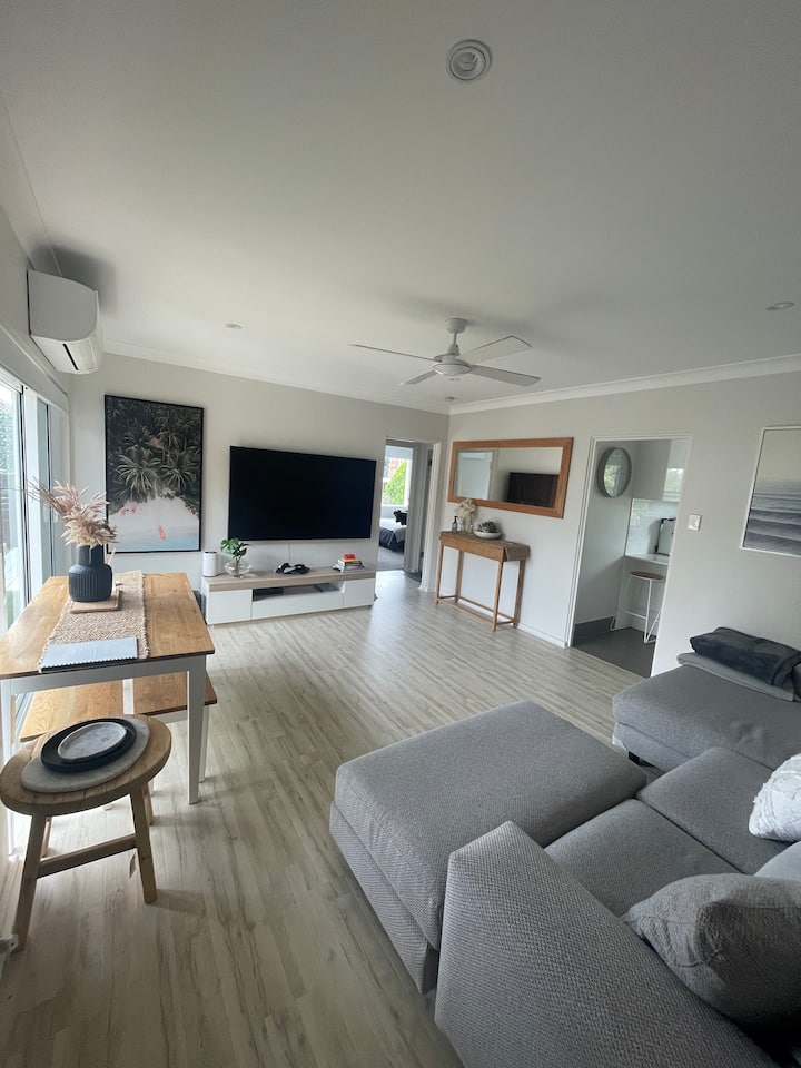 Modern beachside apartment with water views.
