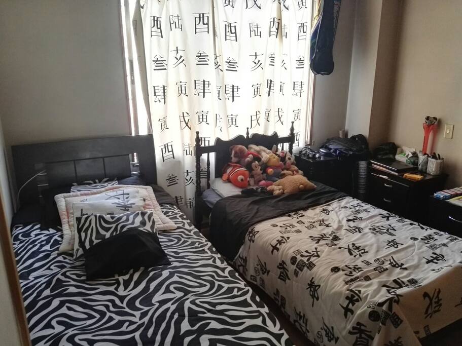 ...or you can have more privacy by staying in this room with two separate beds.