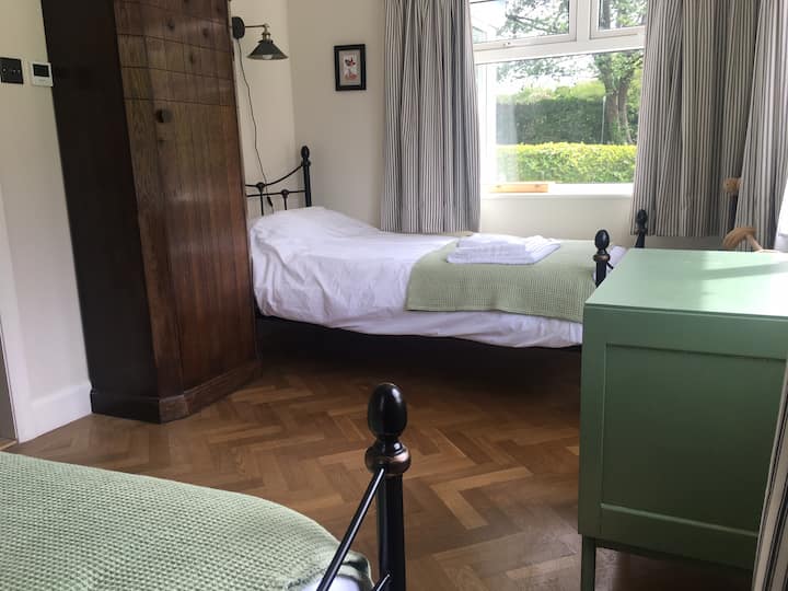 The front bedroom offers two single beds