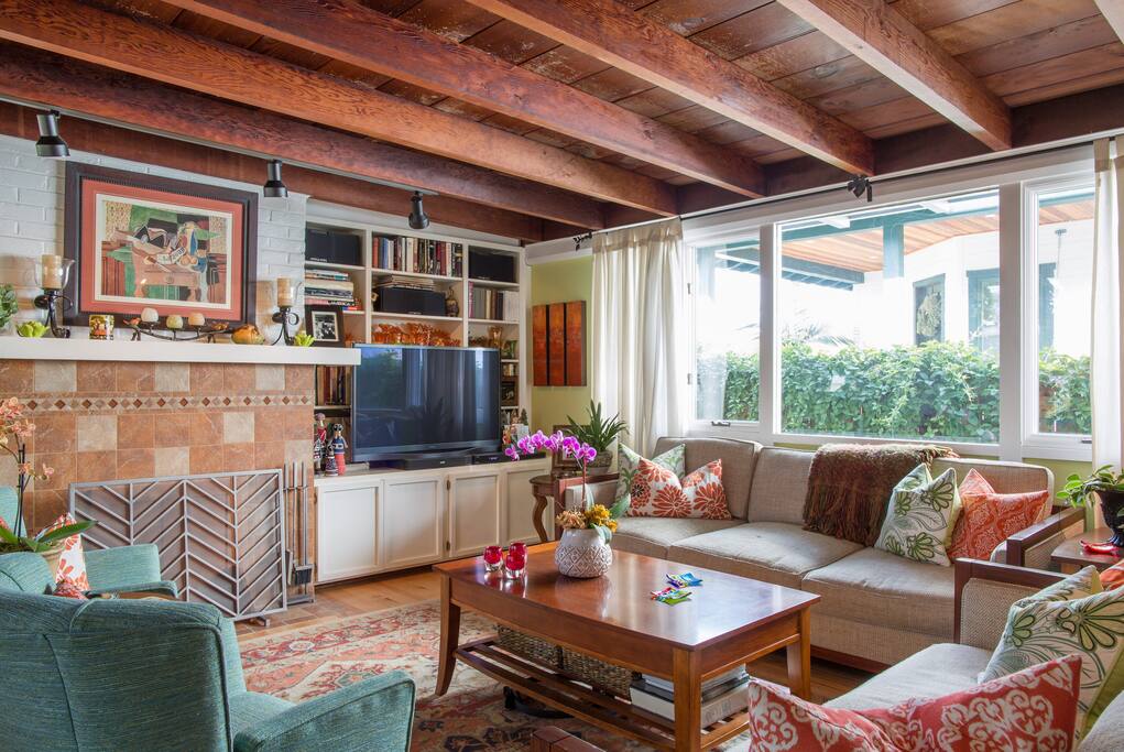 Cozy Living room with wood burning fireplace and Hi-Def internet connected tv
