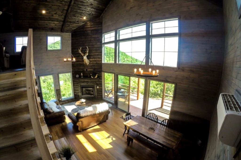 First Floor Living and Dining Room with Gas Fireplace and Panoramic Views