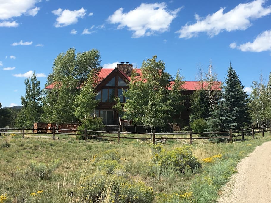 A view of the lodge at the end of the cul de sac in summer