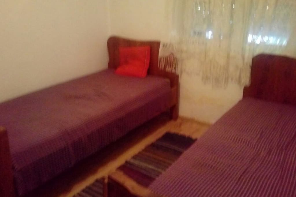 One of the double bedrooms, with comfortable beds, TV and window.