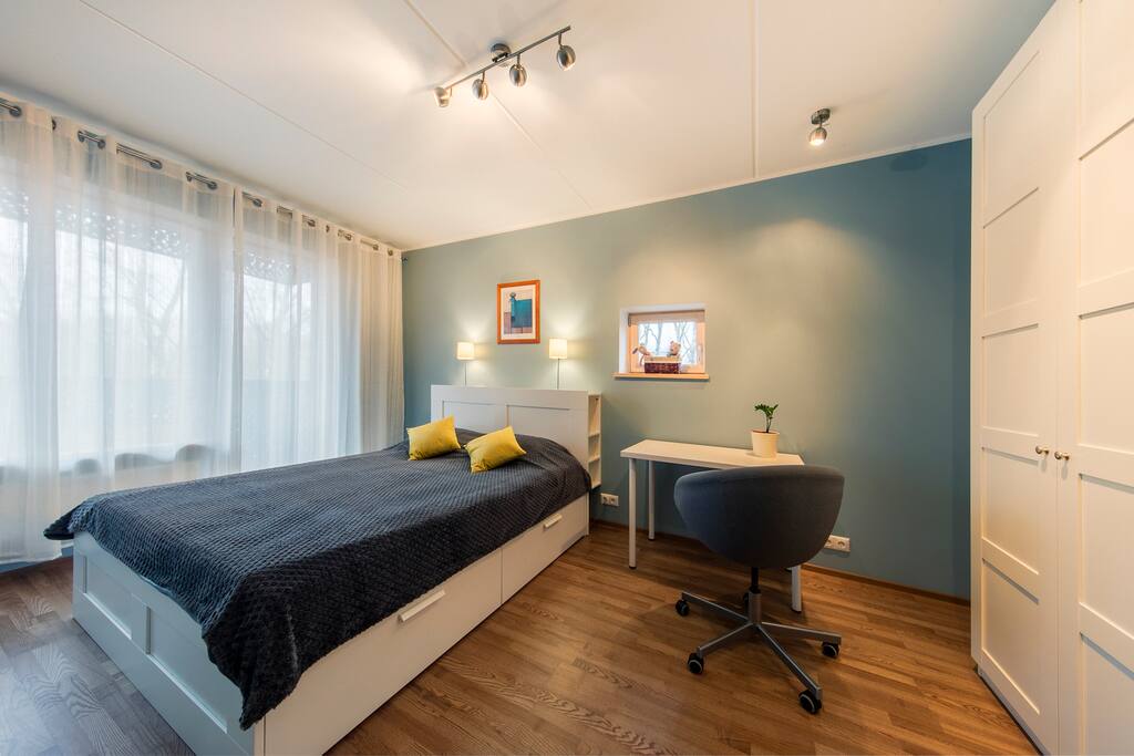 Bedroom has big balcony.