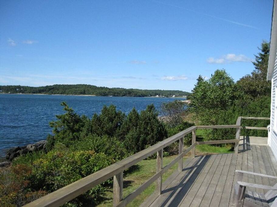 Deck on West side, looking north where a sandy beach beckons explorers of all ages at low tide.