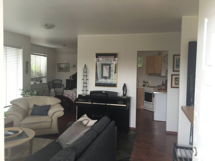 our livingroom opens into kitchen and dining area. there is also a piano free for use
