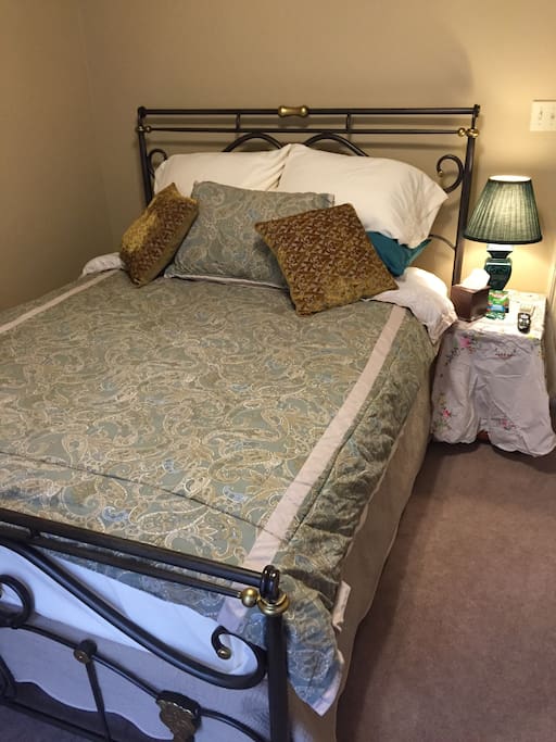 Queen size pillow top with antique bed frame.