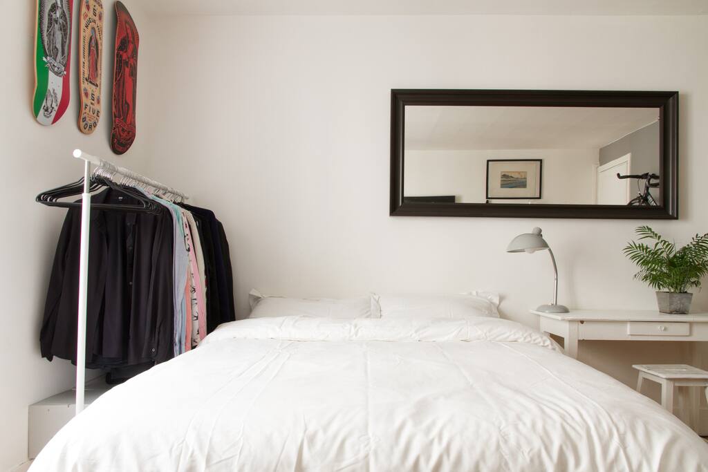The living room with a very big and comfortable bed with fresh organic sheets