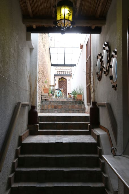 Principal entrance of the house is a big hall and in the end is the second door for get in into the house, have 2 security door