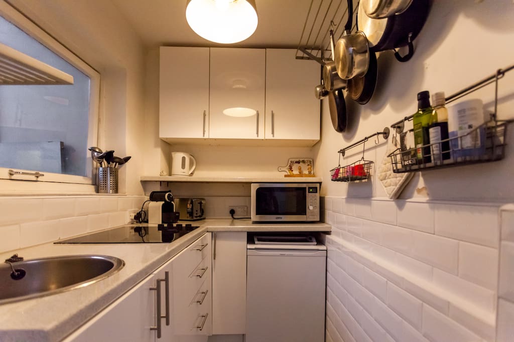 A kitchen with plenty of appliances...