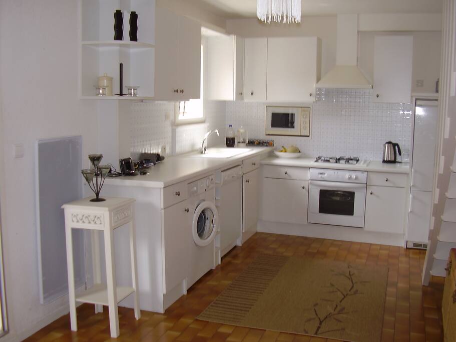 Kitchen has dishwasher, fridge, washing machine, microwave, coffee machine, toaster, iron