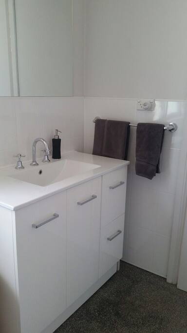Your bathroom also contains the laundry and is off the back verandah.