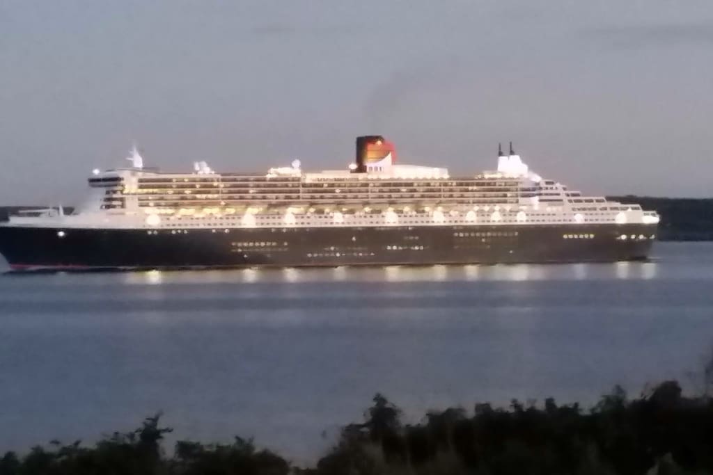 Watch the Cruz ships and the Newfoundland ferry as you relax on the front patio. This ship is called the Queen Mary .