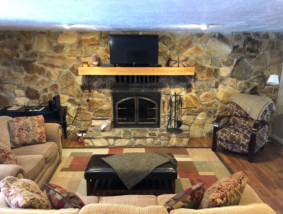 Living room has wood burning fireplace