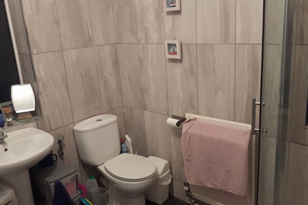 The shared WC/Bathroom is spacious including a walking in shower to the right and a bath to the left.