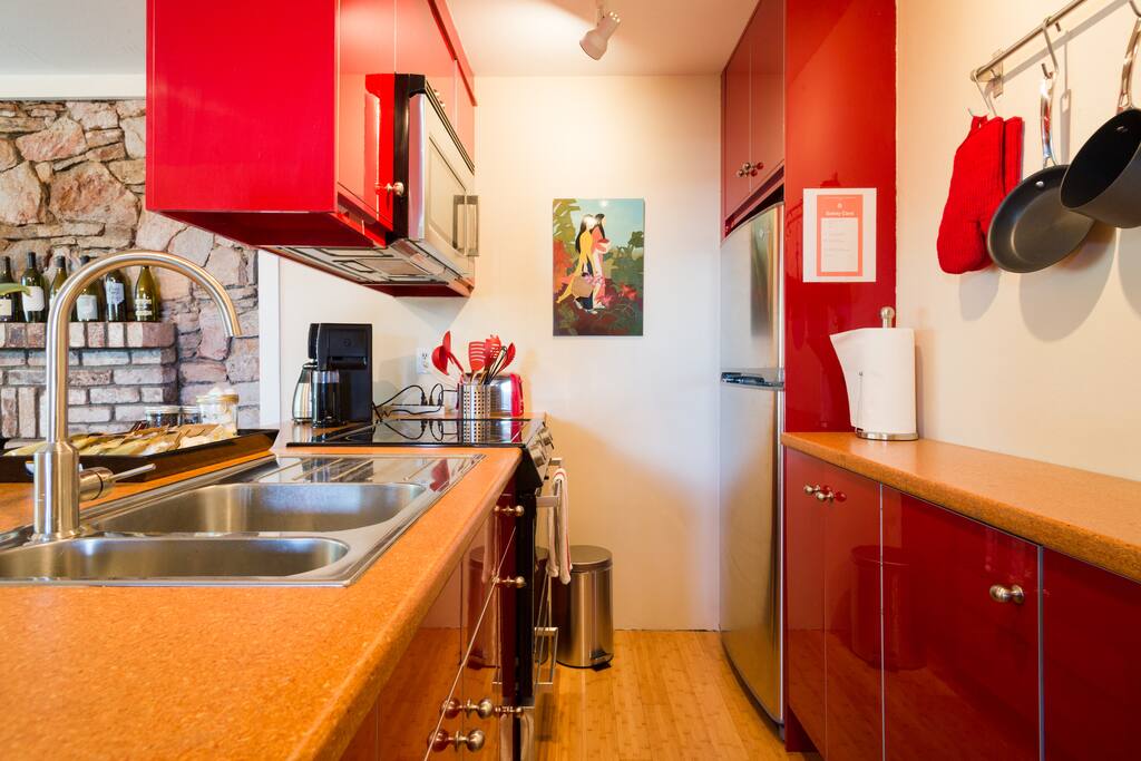 All the essentials to cook a nice meal in this unique, cheery, red kitchen.