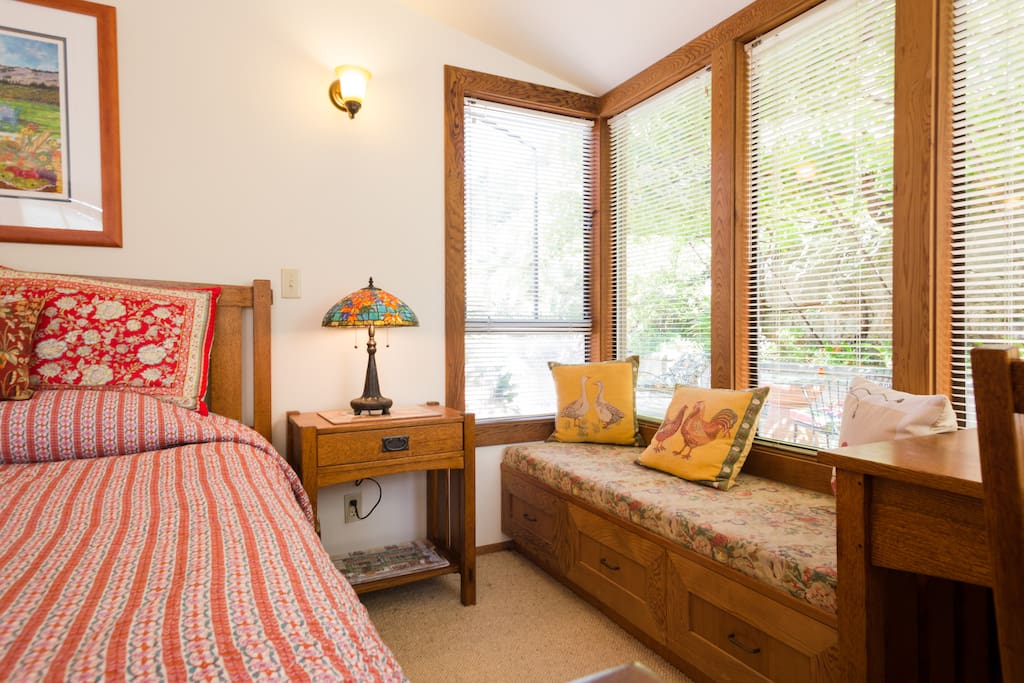 Window seat facing the grape arbor.
