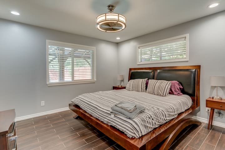Primary bedroom with king size bed and luxury