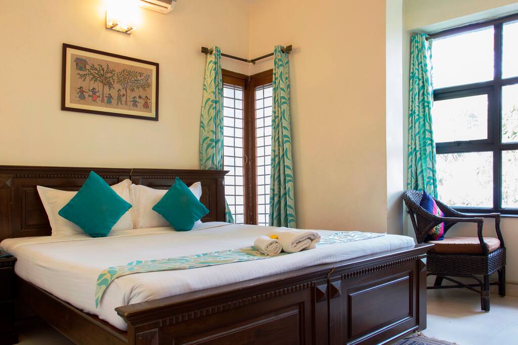 This is has a beautiful front view. It’s for two people . This room has AC , WiFi , TV , side table lamp and attached bathroom .