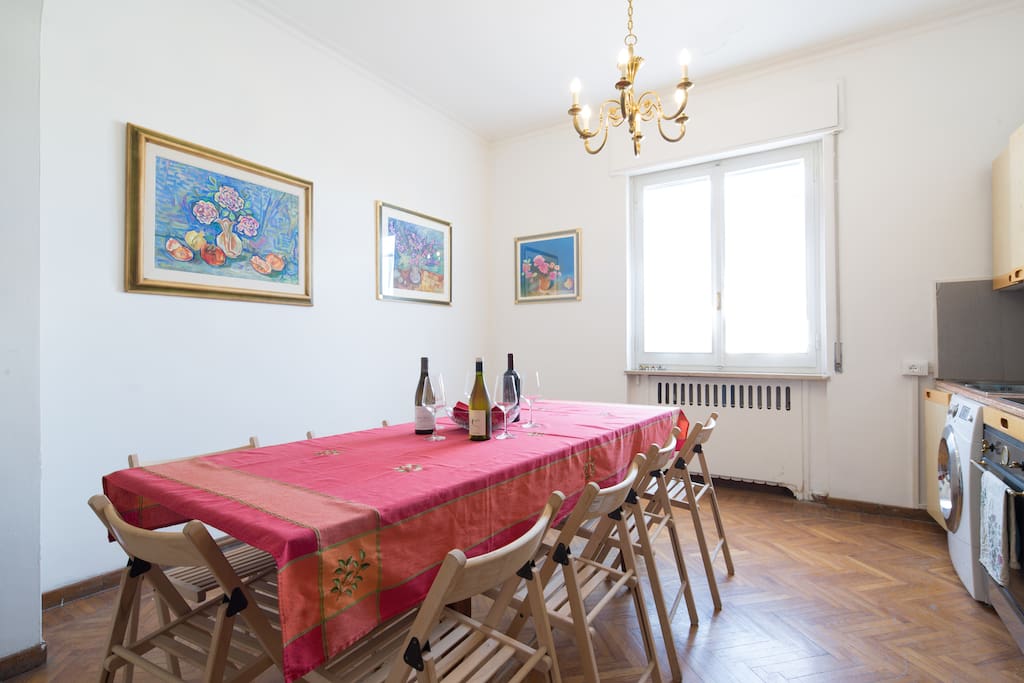 Kitchen with large table for gatherings.