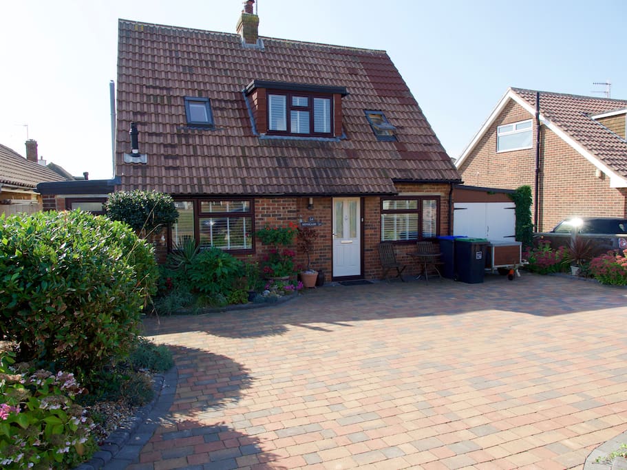 Front of house, showing parking spaces.
