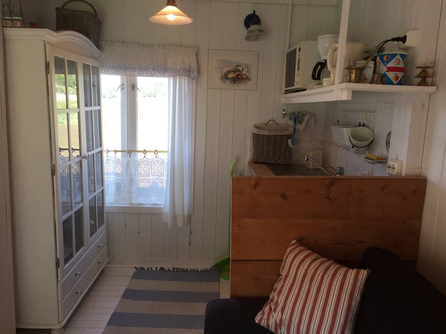 In the kitchen there is a microwave, an electric water boiler and running water. You will have full access to the kitchen in the house though.