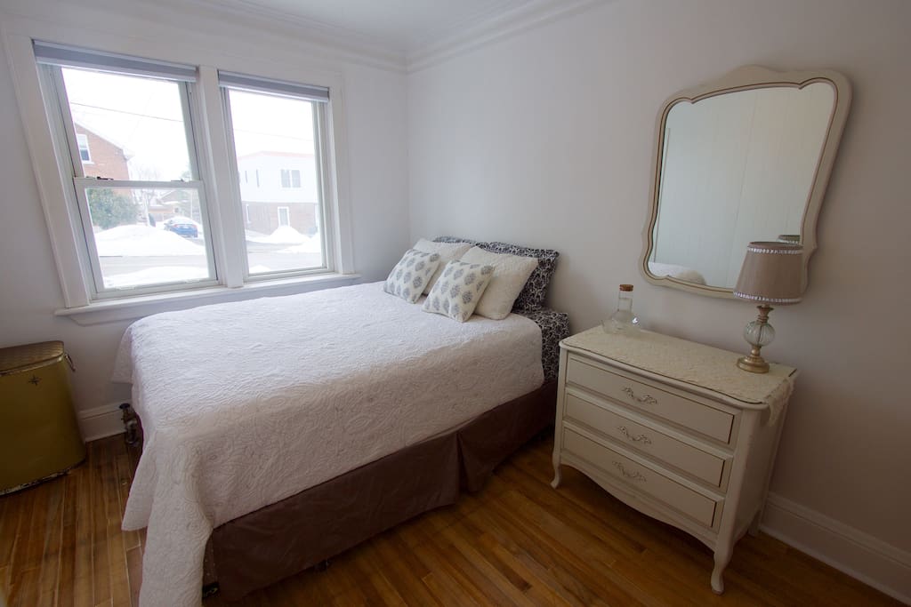 Queen-sized bed, room-darkening blinds.