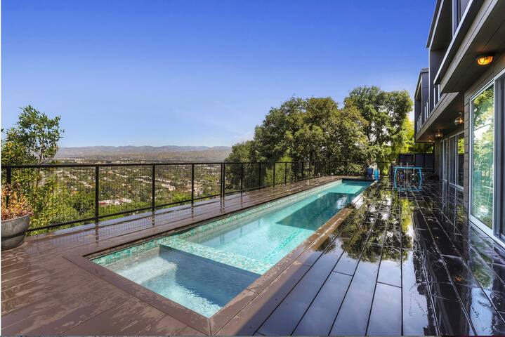 Incredible view with pool & spa in a chic home. gallery image 3