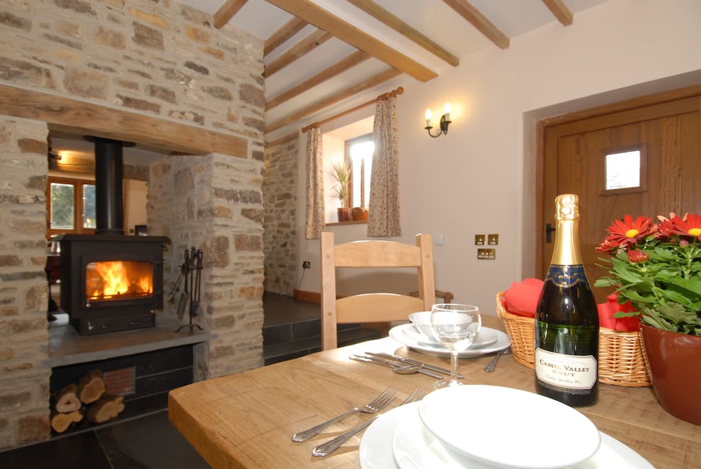 double sided log burner with 2 large baskets of logs provided - ideal for cosy gatherings