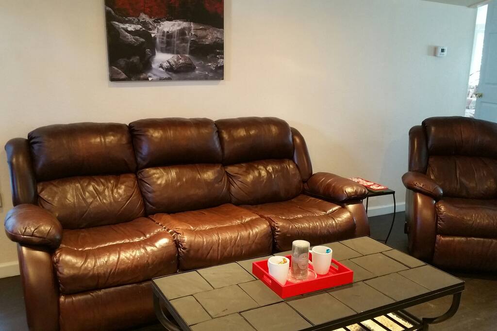 Leather furniture. Recliner lays flat if you like to stretch out.