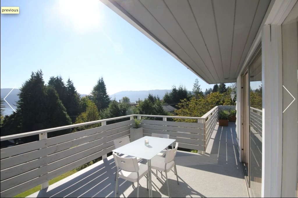 Back deck - where you can view mountains, treetops, an ocean glimpse