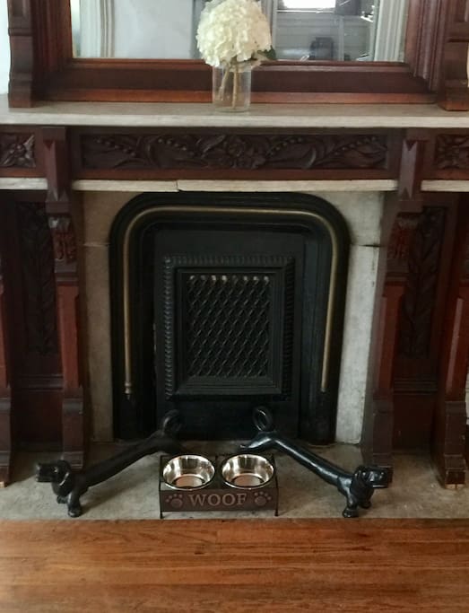 Hand carved floor to ceiling mantle in living room