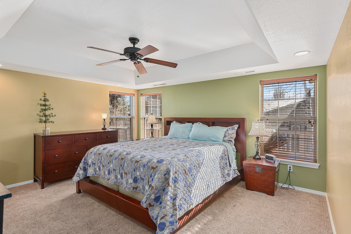 The primary bedroom with a king bed, walk-in closet and a private attached full bathroom.