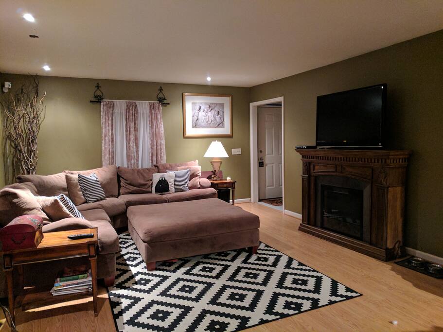 Warning: you WILL fall asleep on this sectional... Super comfy! Electric fireplace, flat screen TV, can lighting or lamp lighting depending on your mood.