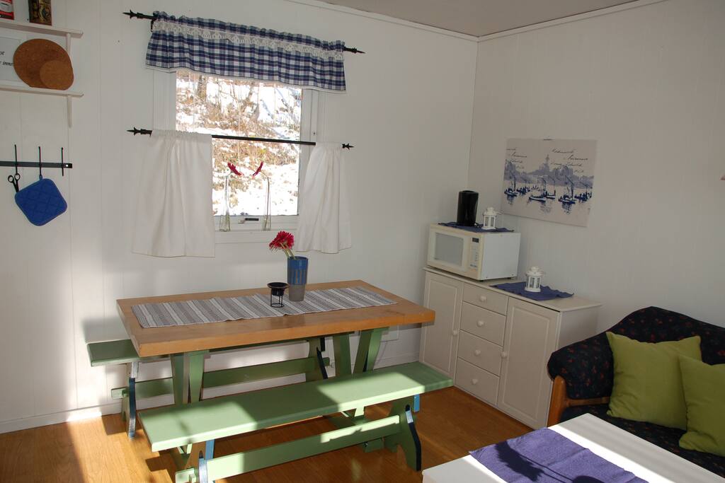 Table and benches, microwave oven.