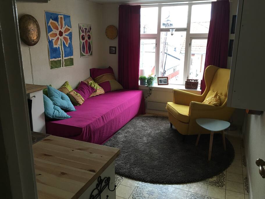 The sitting area is cozy with a nice view. Combined with kitchen.