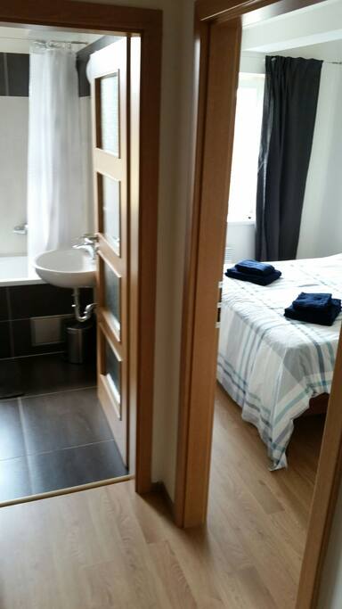 Bathroom and bedroom, view from entrance hall.
