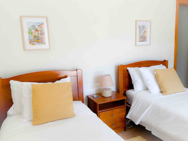 Twin bedroom with access to courtyard and garden. Spacious closets. 