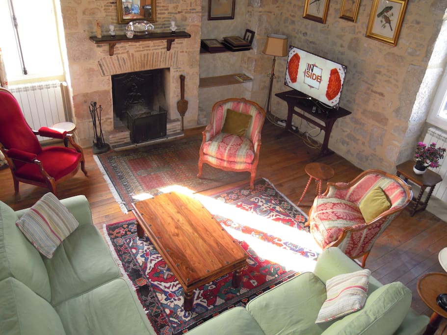 The living room is furnished with antiques. The TV gets 60 English channels including CNN. The fireplace works. DVD player.
