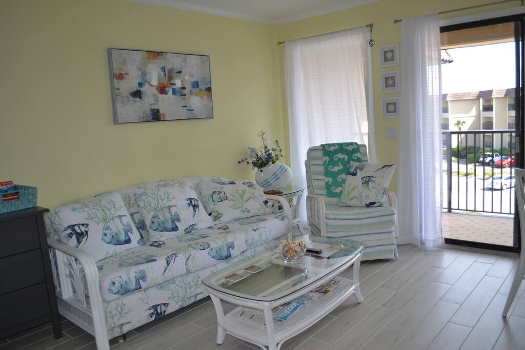 Comfortable sofa has hide away memory foam mattress.