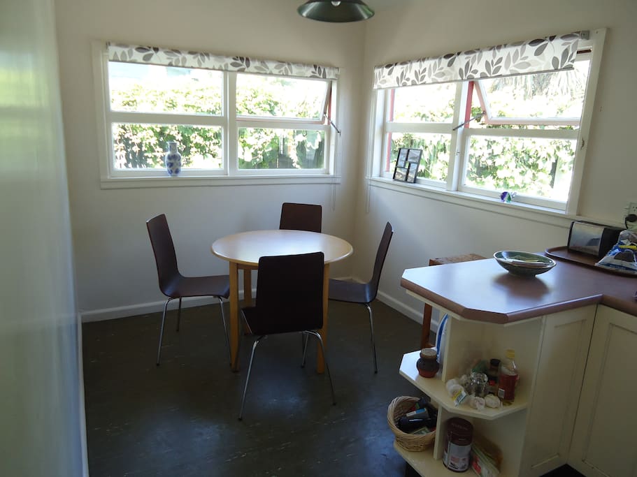 Sunlit dining area beside the kitchen, which you are welcome to use to prepare your meals.