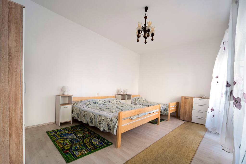 first bedroom with 3 beds