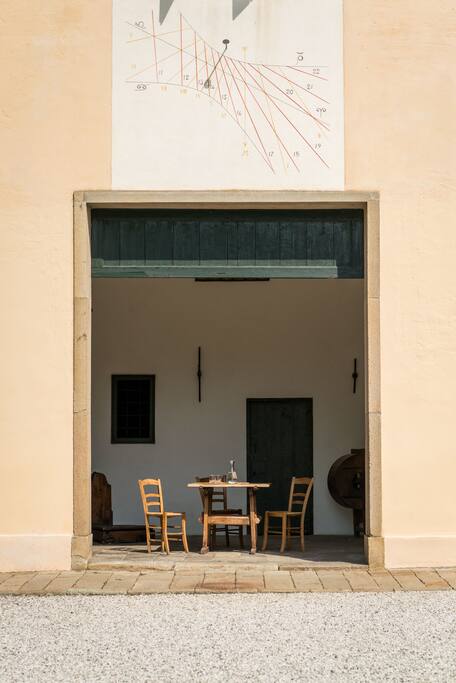 Table and chairs for al fresco meals under the porch