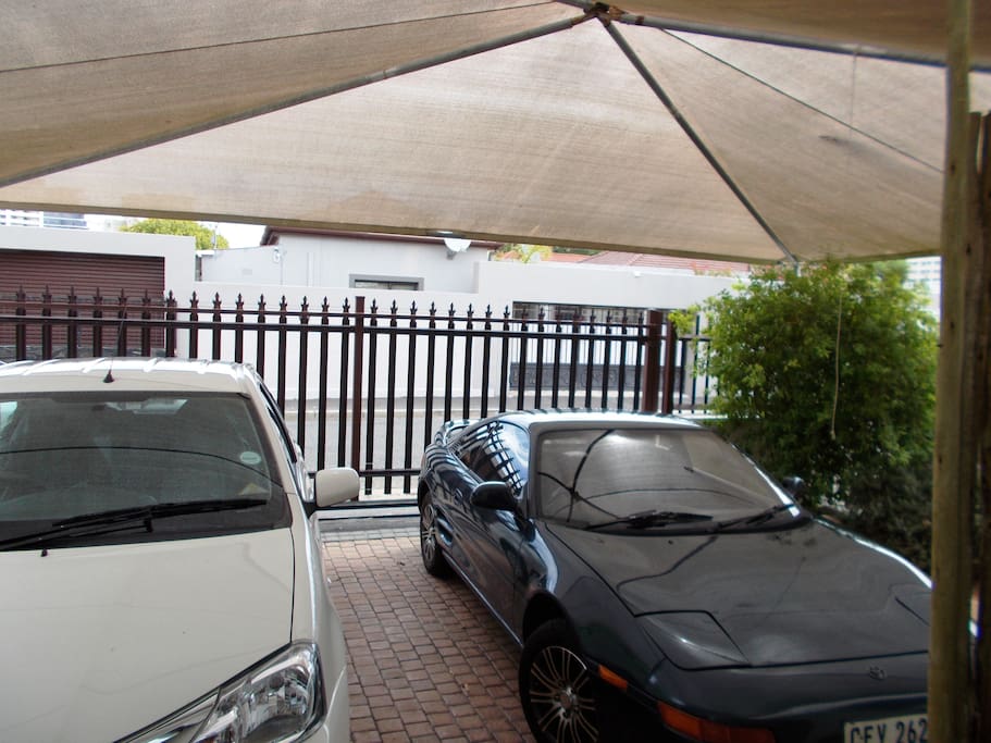 Carport behind motorized security gate