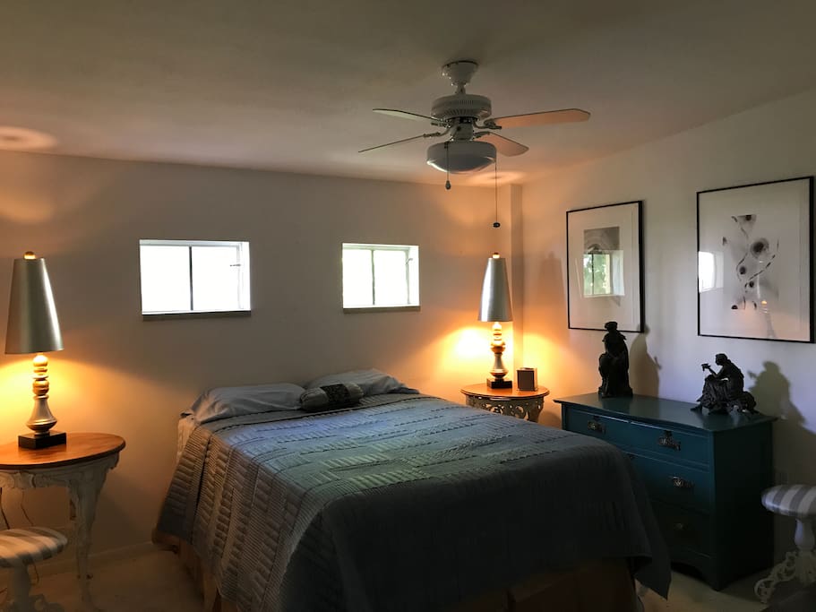 The Art Nouveau Room, furnished with several pieces from the era. The bed is a queen-size pillow-top which is very comfortable. The room is on the backside of the apartment which is usually quiet. The dresser is empty save for a light blanket if you need and two beach towels.