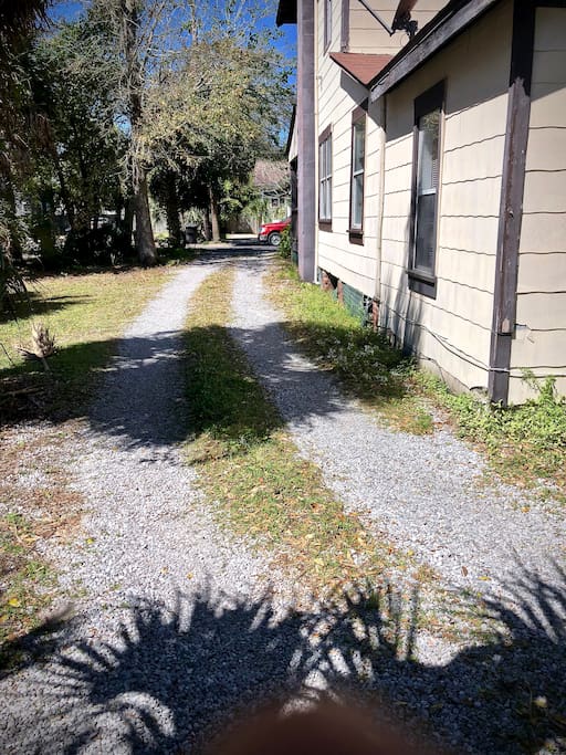 This is the driveway that leads to the back parking area behind the house.