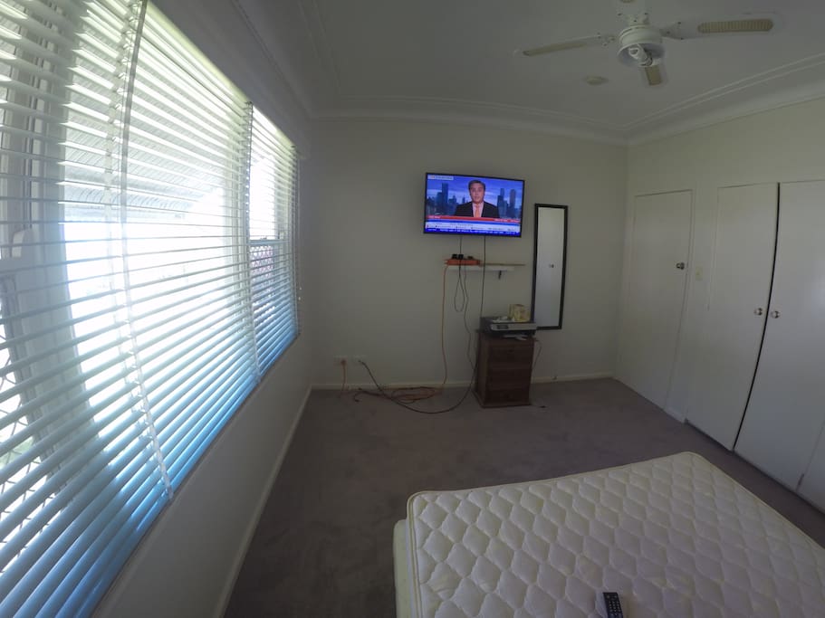 Large room double bed, TV, Builtins, AC, Ceiling Fan.