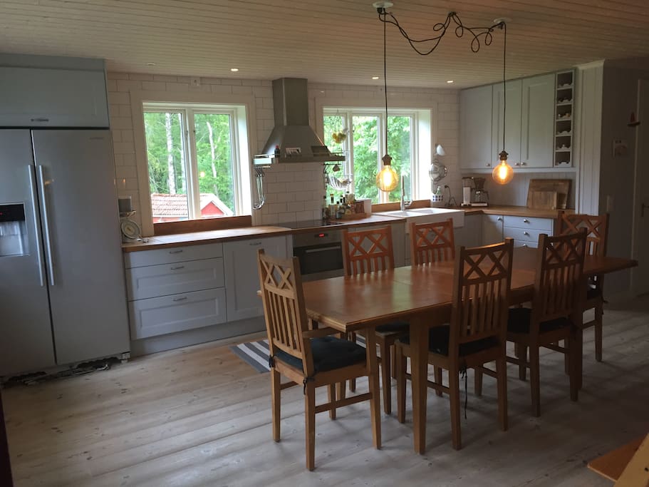 The kitchen is located next to the entrance and is spacious with modern equipment.
