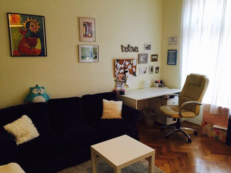 Comfortable sofa and a separate desk for moments you need to be on the laptop